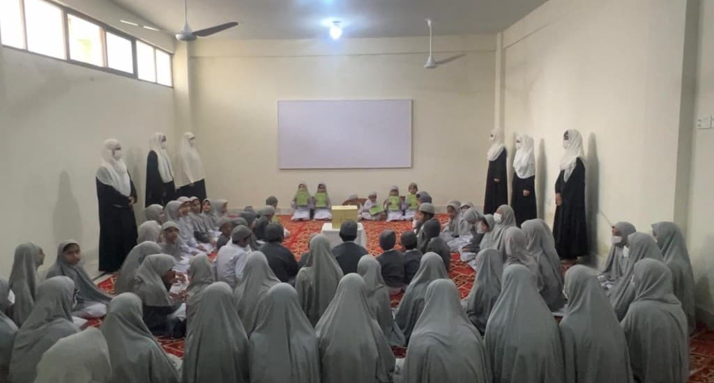 Students gathered in a classroom session at Mahmoodia Foundation.